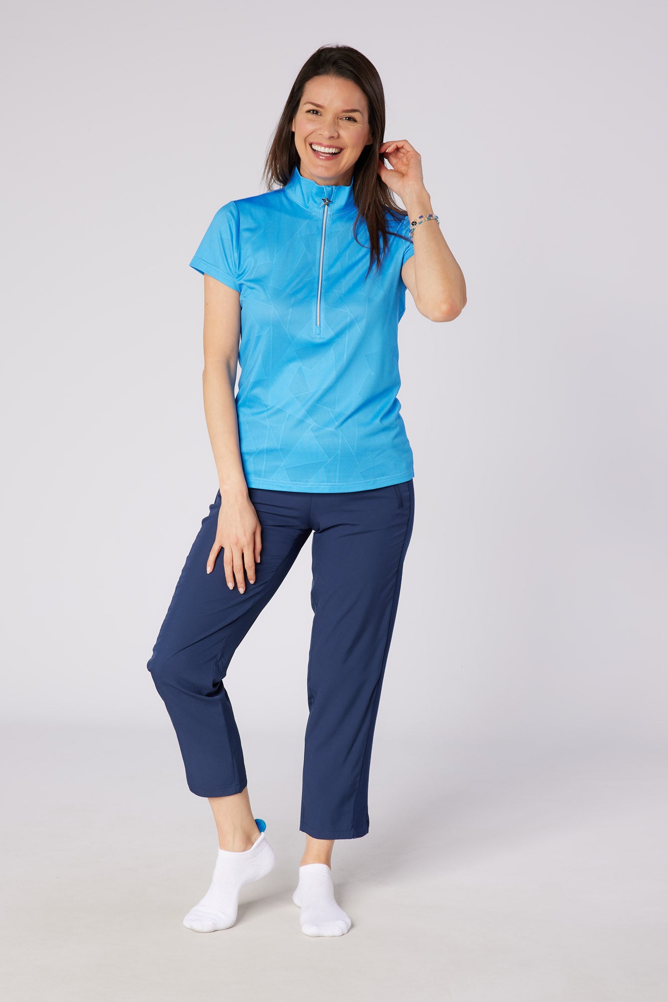 Swing out Sister Embossed Mirage Cap Sleeve Ladies Polo with Zip Neck in Ocean Blue