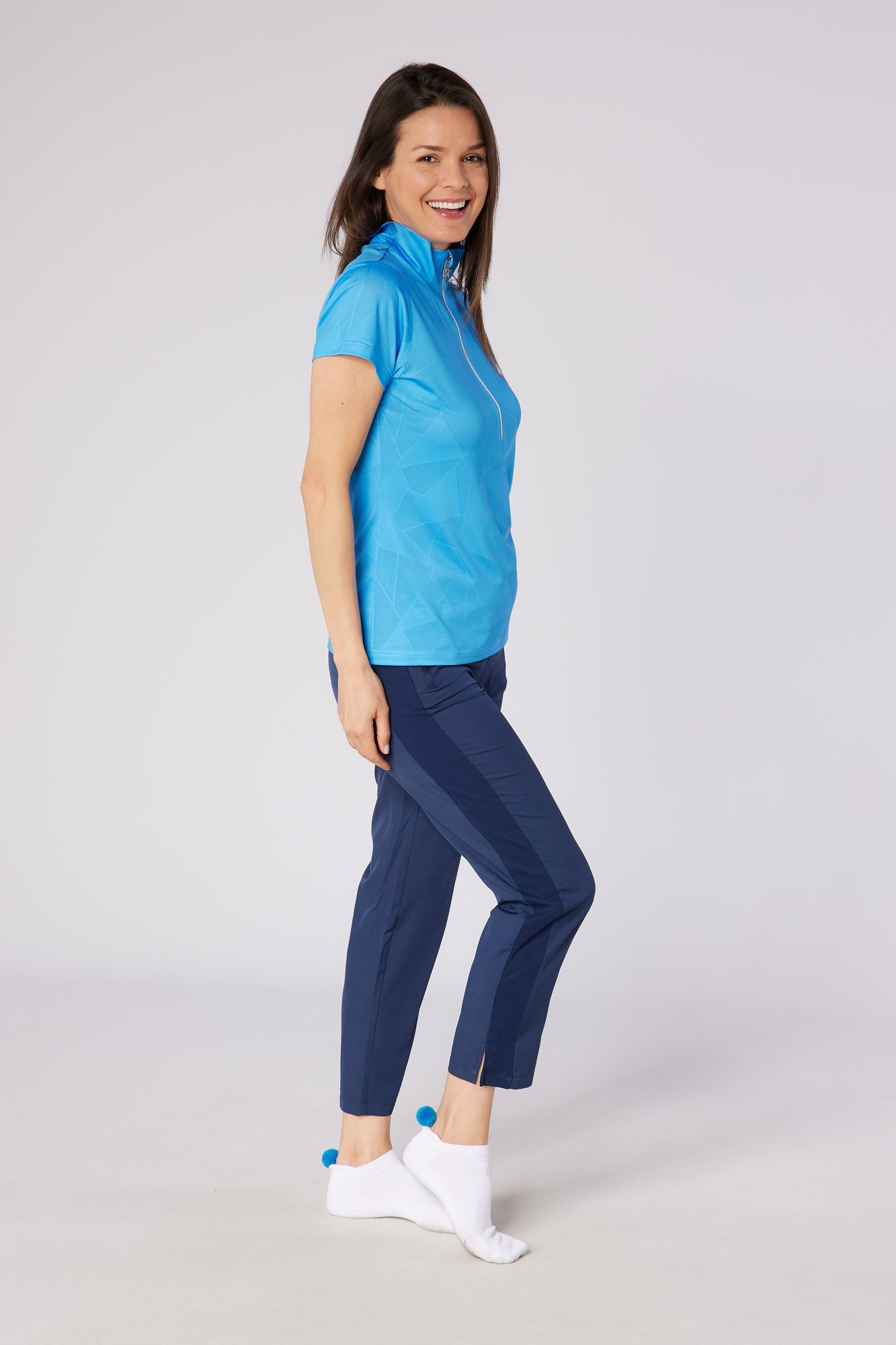 Swing out Sister Embossed Mirage Cap Sleeve Ladies Polo with Zip Neck in Ocean Blue